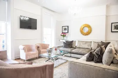 a living room with a couch and a table at Liverpool Georgian Quarter Townhouse Rodney St in Liverpool