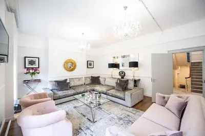 a living room with a couch and a table at Liverpool Georgian Quarter Townhouse Rodney St in Liverpool