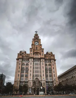 a large building with a clock tower on top of it at Maldron Hotel Liverpool City Centre in Liverpool