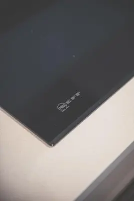 a laptop computer sitting on top of a table at 2BR Apt - Balcony - River View in Liverpool