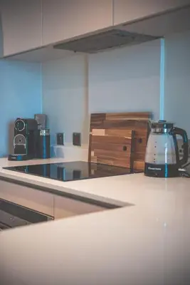 a kitchen counter with a tea kettle on it at 2BR Apt - Balcony - River View in Liverpool
