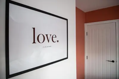 a framed picture on a wall next to a door at Beach Apartments - 1st Floor Cleveleys in Cleveleys