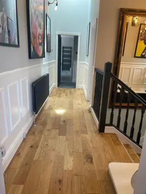 a hallway with a wooden floor in a house at East Cliff in Preston