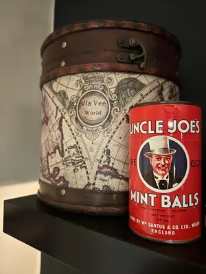 a jar of nut balls next to a can of nut butter at T'house in wigan in Pemberton