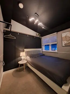 a bedroom with a large bed and a table at L2 APARTMENT- near CAVERN QUARTER in Liverpool