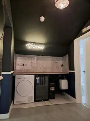 a welcome sign on the wall of a kitchen at L2 APARTMENT- near CAVERN QUARTER in Liverpool