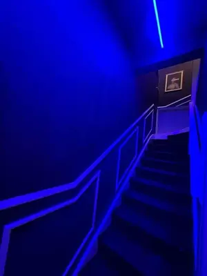 a staircase in a blue room with blue lights at L2 APARTMENT- near CAVERN QUARTER in Liverpool