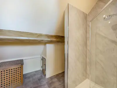 a bathroom with a shower and a walk in shower at Cartmel Place in Cartmel