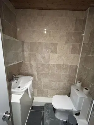 a small bathroom with a toilet and a sink at Bethel Suite by Sasco Apartments in Blackpool