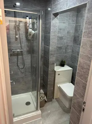 a bathroom with a shower and a toilet at 2-Bedroom Flat w/ En-Suites, Perfect for Groups in Liverpool