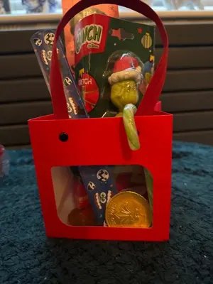 a red gift box with a toy in it at Winter Gardens Large Flat 1 in Blackpool