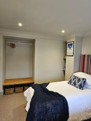 a bedroom with a large white bed in a room at Woodland Retreat in Lytham. in Lytham St Annes