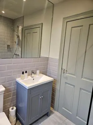 a bathroom with a sink and a toilet and a mirror at Woodland Retreat in Lytham. in Lytham St Annes