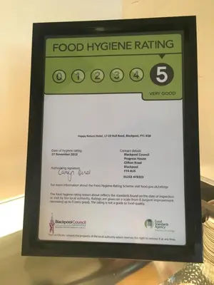 a framed sign for a food hygiene rating at Happy Return Hotel in Blackpool