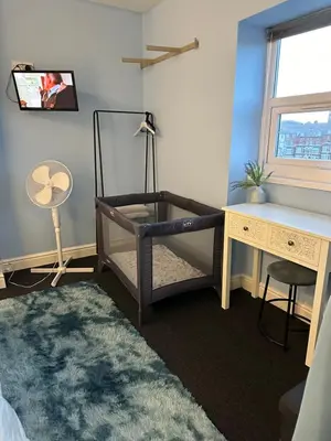 a bedroom with a bed and a desk and a desk at Winter Gardens Flat 4 Tower view family apartment in Blackpool