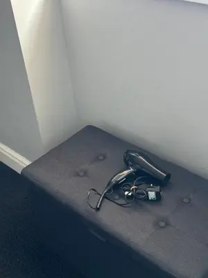 a pair of scissors sitting on top of a bed at Winter Gardens Flat 4 Tower view family apartment in Blackpool