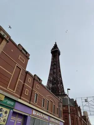a view of the eiffel tower behind a building at Winter Gardens Flat 4 Tower view family apartment in Blackpool