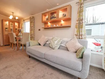 a living room with a couch and a table at Larenzo in Preston