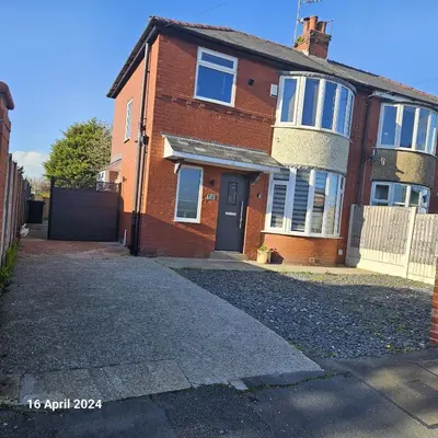 a brick house with a driveway in front of it at Aldwych house, For Holidays, Contractors & Relocation, Free Parking & Wi-Fi in Preston