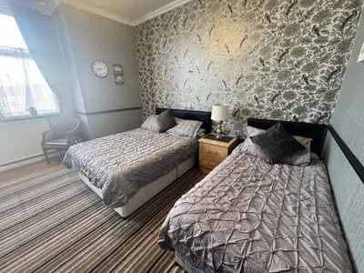 a bedroom with two beds next to each other at The Holmlea in Blackpool