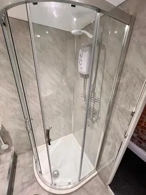 a shower with a glass enclosure in a bathroom at Manhattan loft Apartment by Wilom in Blackpool