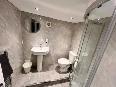 a bathroom with a sink and a toilet and a shower at Manhattan loft Apartment by Wilom in Blackpool