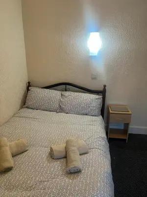 a bedroom with a bed with two pillows on it at Apollo Number 7 in Blackpool