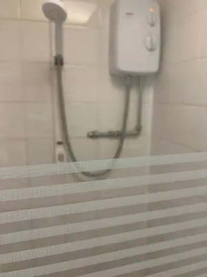 a shower in a bathroom with a shower head at Apollo Number 7 in Blackpool