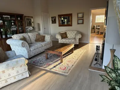 a living room with two couches and a coffee table at Lovely country cottage in Dalton / Parbold in Wigan
