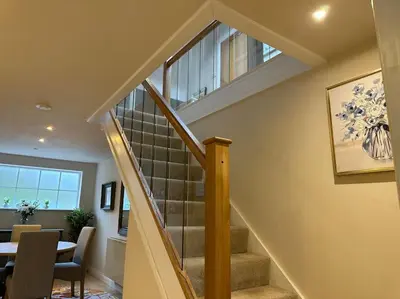 a staircase in a home with a table and chairs at Lovely country cottage in Dalton / Parbold in Wigan