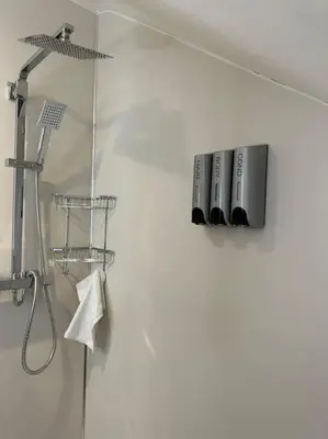a bathroom with a shower with a sink and a shower at Lovely country cottage in Dalton / Parbold in Wigan