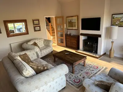 a living room with a couch and a coffee table at Lovely country cottage in Dalton / Parbold in Wigan