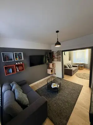 a living room with a couch and a tv at Cityscape-Cosy House By Anfield in Liverpool