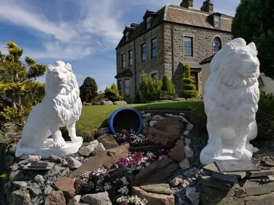 two statues of polar bears in front of a house at Duddon Villa in Millom