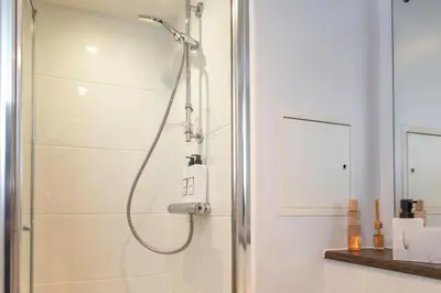 a shower with a glass door in a bathroom at L1 Comfy Escapes - Long Stay Discounts Apply! in Liverpool