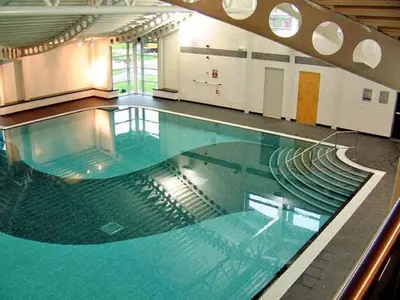 a large swimming pool in a building at 26 Sherwood, South Lakeland Leisure Village in Carnforth