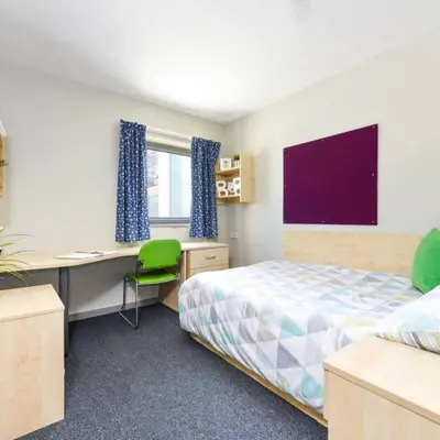 a bedroom with a bed and a desk and a computer at For Students Only - Capital Gate in Liverpool in Liverpool