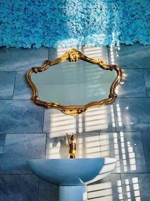 a glass table with a statue on top of it at Monopoly Holiday Home in Blackpool