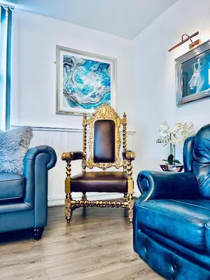 a living room with a chair and a couch at Monopoly Holiday Home in Blackpool