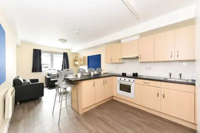 an open kitchen and living room in a apartment at For Students Only Apollo Court in Liverpool in Liverpool