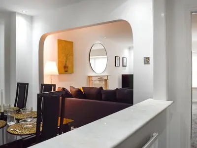 a living room with a couch and a table at West Street House in Southport