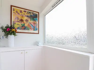 a window in a white room with a painting at 14 Berwick Road in Lytham St Annes