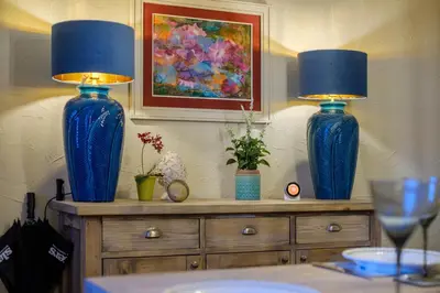 two blue vases sitting on top of a dresser at Sunny Brae in Grange Over Sands