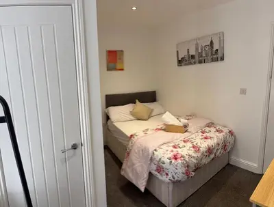 a small bedroom with a bed in a room at Lovely Double Bedroom in Liverpool