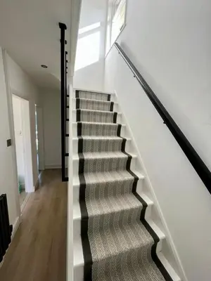 a stairway in a house with a stair case at Bright 3 bedroom house with conservatory in Birkenhead