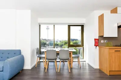 a kitchen and dining room with a table and chairs at For Students Only Byrom Point in Liverpool in Liverpool
