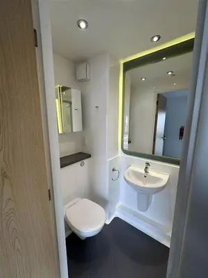 a bathroom with a toilet and a sink and a mirror at For Students Only Byrom Point in Liverpool in Liverpool