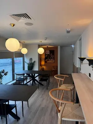 a dining room with tables and chairs and lights at For Students Only Byrom Point in Liverpool in Liverpool