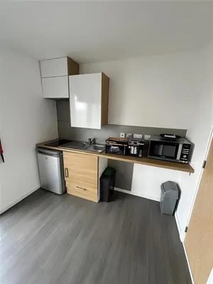 a small kitchen with a sink and a microwave at For Students Only Byrom Point in Liverpool in Liverpool