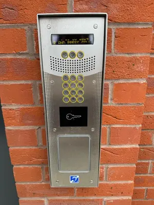 a parking meter attached to a brick wall at Richmond Row by L3 Apartments in Liverpool